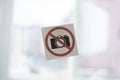 a camera banned symbol icon sticker on the wall in public place, shooting restriction area