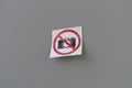 a camera banned symbol icon sticker on the wall in public place, shooting restriction area