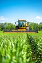 The camera captures a low angle shot of a new combine harvester set against a blue sky Royalty Free Stock Photo