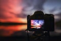 Camera capturing sunset. Photography view landscape.