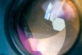 Camera diaphragm aperture with window reflection flare and reflection on lens Royalty Free Stock Photo