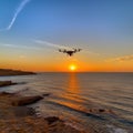 Camera drone flying on a beach at sunset, AI Generated Royalty Free Stock Photo