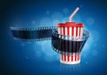 Camera film roll and cardboard cup with a straw. Royalty Free Stock Photo