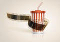 Camera film roll and cardboard cup with a straw. Royalty Free Stock Photo