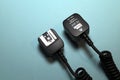 Camera flash sync cable on blue background Royalty Free Stock Photo