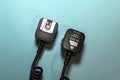 Camera flash sync cable on blue background Royalty Free Stock Photo