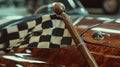 The camera focuses on a custommade wooden stick with a smooth handle used for holding and waving the checkered flag. The