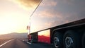 Semi-trailer truck driving along a desert road into the sunset