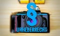 Camera with in german Urheberrecht in english copyright Royalty Free Stock Photo