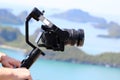 Camera Gimbal Stabilizer on top of the mountain. Ocean and blue Royalty Free Stock Photo