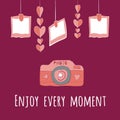 Camera girlnda of hearts and photos.enjoy every moment lettering. Royalty Free Stock Photo