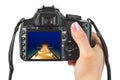 Camera in hand and beach landscape Royalty Free Stock Photo