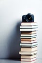 Camera on a high stack of books