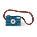 Camera on a leather strap in a flat style. Small camera with flash, dark blue, isolated on a white background. Color Royalty Free Stock Photo