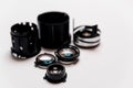 Camera lens disassembled. elements and pieces of lens glass lay on white background in order. professional photographic equipment