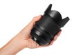 Camera lens in hand isolated on white background Royalty Free Stock Photo