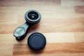 Camera lens for mobile telephones put on the wooden surface