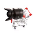 Camera lens in shopping cart isolated Royalty Free Stock Photo