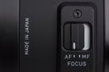 Camera lens focus switch