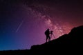 Camera man silhouette on the mountain over milky way night sky Royalty Free Stock Photo