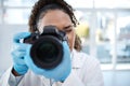 Camera, medical and forensics with black woman in laboratory for investigation, crime scene and photography evidence