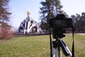 Camera mounted on a tripod. Digital camera for taking photos. Details and close-up. Royalty Free Stock Photo