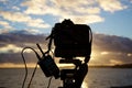 Filming timelapse of sunset over sea Royalty Free Stock Photo