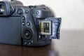 Camera with open CFexpress card slot. Royalty Free Stock Photo