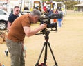 Camera operator records video with fire engines in view.