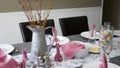 Camera pans over easter dinner table decorated