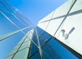 Facade of modern office building in glass and steel with reflections of blue sky Royalty Free Stock Photo