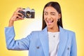 Camera, photography and woman picture with a smile and wink for job in studio. Happy, young female person and yellow