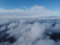 High above the thick fog, like beautiful ocean of clouds at sunrise. Sun is rising above the endless sea of clouds until Royalty Free Stock Photo