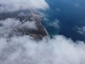 High above the thick fog, like beautiful ocean of clouds at sunrise. Sun is rising above the endless sea of clouds until Royalty Free Stock Photo