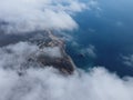 High above the thick fog, like beautiful ocean of clouds at sunrise. Sun is rising above the endless sea of clouds until Royalty Free Stock Photo