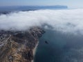 High above the thick fog, like beautiful ocean of clouds at sunrise. Sun is rising above the endless sea of clouds until Royalty Free Stock Photo