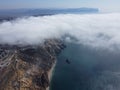 High above the thick fog, like beautiful ocean of clouds at sunrise. Sun is rising above the endless sea of clouds until Royalty Free Stock Photo