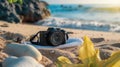 A camera rests on a beach blanket for a scenic shot AIG50