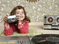 Camera retro photo little girl in vintage room Royalty Free Stock Photo