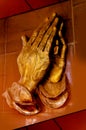 Golden praying hands