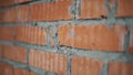 Close up view of wall with red bricks and grey concrete in workhouse.