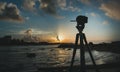 Camera standing on tripod at sunrise, caribbean sea, landscape