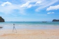 The camera stands on the beach of the tropical sea. The photographer`s dream about his work. Soft focus Royalty Free Stock Photo