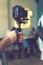 Camera on steadicam in male hands. videography, filmmaking, hobby and creativity concept. toned