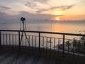 camera take sunrise picture over sea and beach at Hua Hin, Thailand