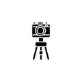 Camera with the tripod black icon concept. Camera with the tripod flat vector symbol, sign, illustration. Royalty Free Stock Photo