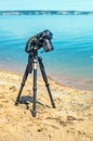 Camera on a tripod near the seaside