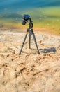Camera on a tripod near the seaside
