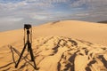 Camera on a tripod at sand dunes