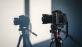 Camera on Tripod with Shadow, Photography Equipment, Studio Setup Royalty Free Stock Photo